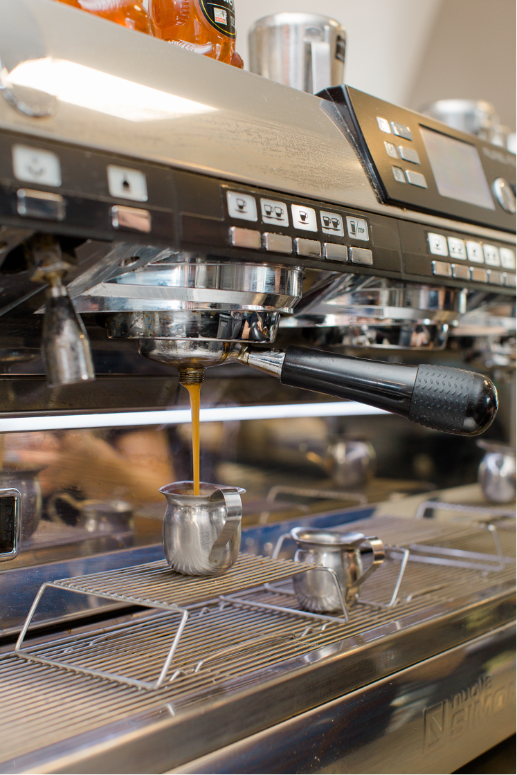 An espresso shot being poured at Aroma Joe’s.